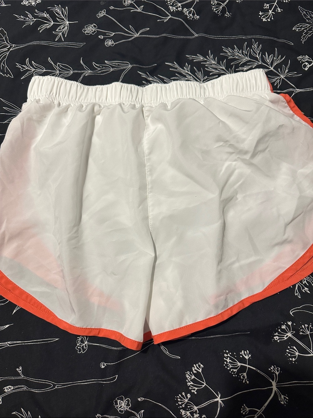 Nike Women's White Athletic Shorts with Orange Trim - Picture 2 of 2